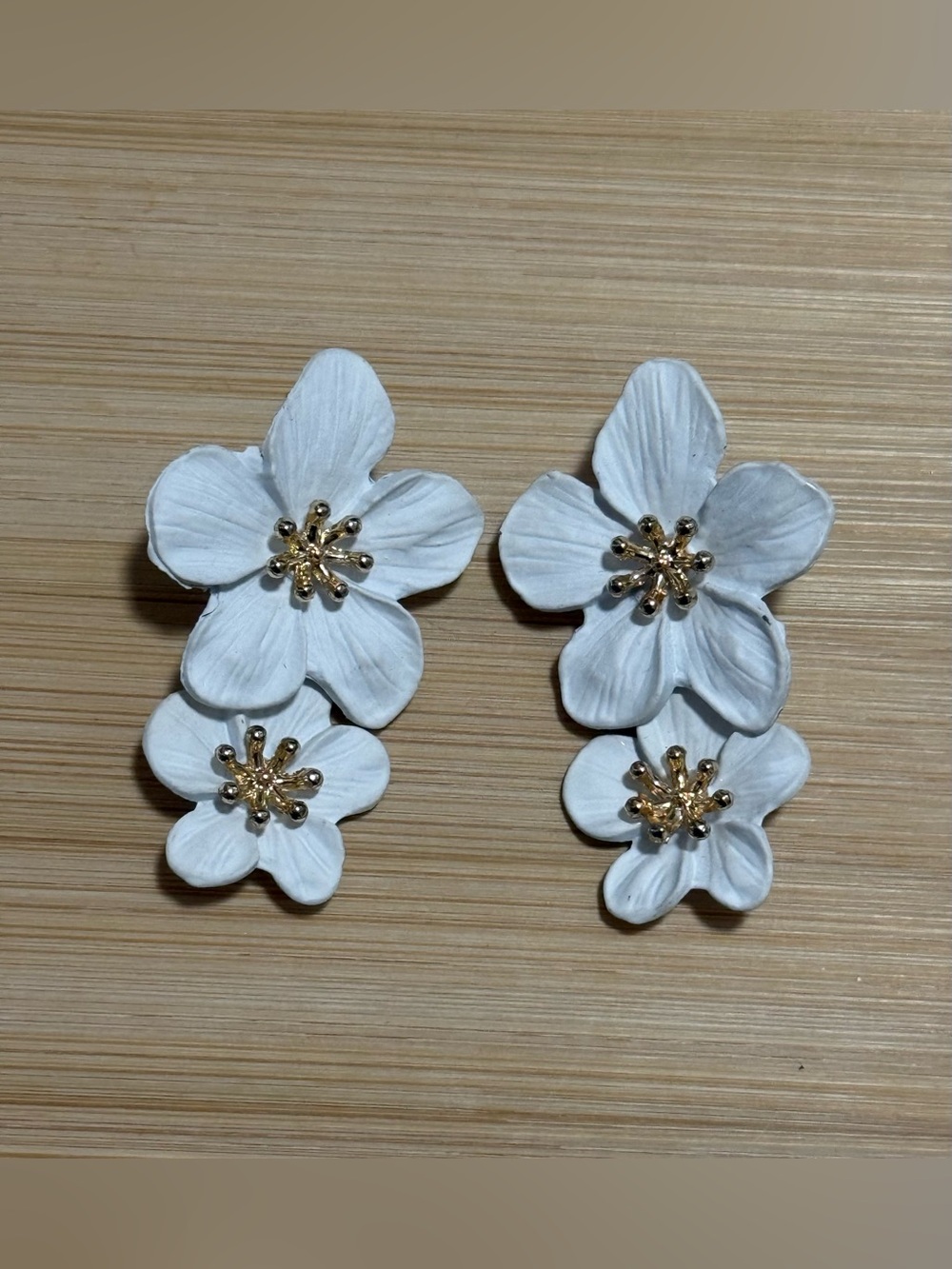 White Floral Stud Earrings with Gold Accents